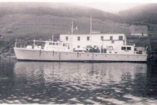 Christmas Seal docked at Canning's wharf in Presque
The vessel was built by the Casey Boat Building Company of Fairhaven, Massachusetts, in early 1943, as a 104-foot military crash rescue boat and designated P-102. Under the name USCB Shearwater, she operated from the Naval Air Station Argentia until 10 September 1947 when she was purchased by the Newfoundland Tuberculosis Association for US$5,000 and converted into a floating clinic.&amp;nbsp;
Renamed the M/V Christmas Seal, from 1947 the vessel sailed to isolated outports on the coast of Newfoundland, screening residents for tuberculosis, which was a leading cause of death on the island.&amp;nbsp;Under the command of Captain Peter Troake from 1950, the ship was fitted to provide chest X-rays, and also carried out vaccinations for TB and polio, and tested for diabetes. Doctors, nurses, technicians, and health educators staffed the vessel in addition to the operating crew. The ship also provided general health education in the form of leaflets, talks and film shows, as well as providing emergency medical evacuations. A measure of the success of Christmas Seal can be seen in mortality rates; in 1947 there were 500 deaths from TB in the province, in 1958 it was 64. By 1970, the decline in rates of infection, and the improvements in road access on the island, meant that the services of Christmas Seal were no longer required.